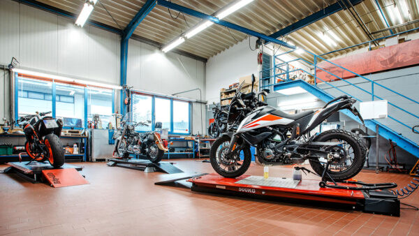 a motorcycle on a platform in a garage